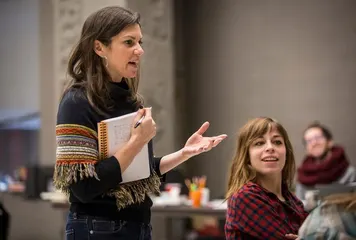Kimberly Senior teaching, notebook in hand